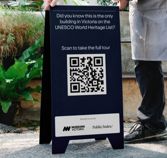 Public Index QR code sign in front of a building